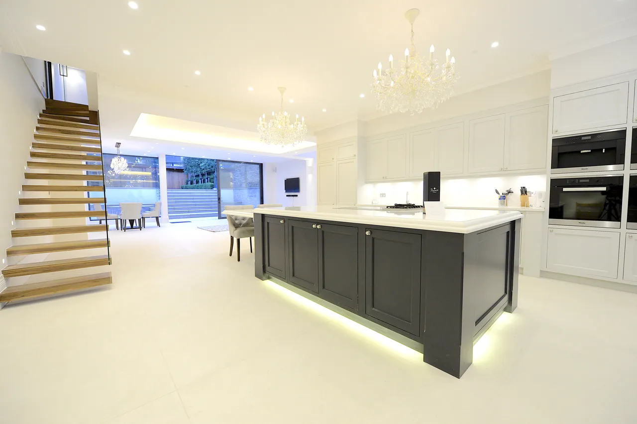 New kitchen with island, looking back towards the open stair