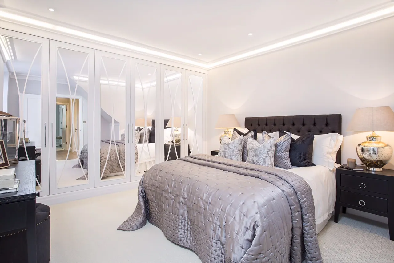 Principal bedroom with fitted mirrored wardrobes