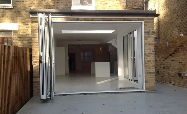 Bi-fold doors opened across the full width of the new opening