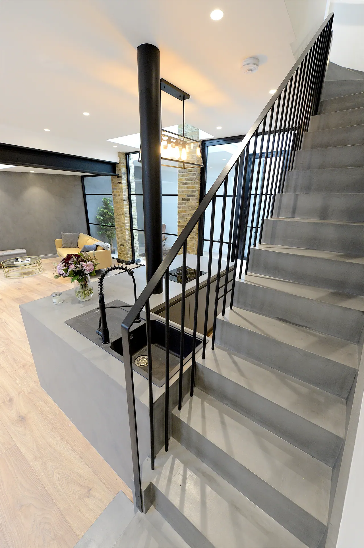 The new stair: cast treads and a blackened steel balustrade
